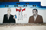 MLK Jr. mural at West Montana Street and Woodward Avenue, Highland Park, MI, 2009. A local artist said the mural was about "Three powerful men, three men that changed the world."