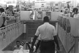 Customers on the stairs leading to the basement of the H. L. Green Department Store on Dexter Avenue in Montgomery, Alabama.