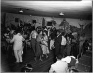 African-Americans on dance-floor of 180 Club, Atlanta, Georgia. Segregated party sponsored by Davison-Paxon Company, October 1954.