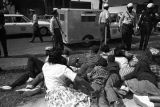 Young civil rights demonstrators lying on a sidewalk after being stopped by police during the Children's Crusade in Birmingham, Alabama.