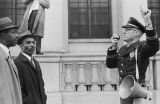 Fred Shuttlesworth and other civil rights demonstrators confronting a police officer during a protest march in downtown Birmingham, Alabama.