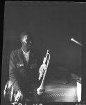 [Noel Lebeau with trumpet in hotel room, Shreveport, Louisiana]