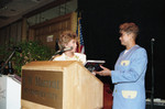 Thumbnail for Iris Rideau presenting a book to Evelina Williams, Los Angeles, 1992