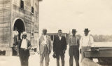 Men standing in front of a rural African American school in Boykin, Alabama.