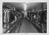 Interior view of Rhythm Records and Sporting Goods with Leroy Smith behind the counter.