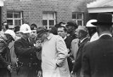 Policeman lighting a cigarette for Wilson Baker during the "Berlin Wall" demonstrations in Selma, Alabama.