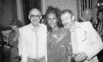 Mary Wilson posing with guests at her birthday party, Los Angeles, 1985