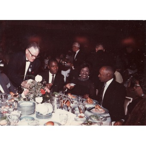 Laymon and Inez Irving Hunter seated at a formal dinner