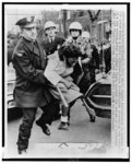 [Police struggle with African American female civil rights protester reacting to death of fellow demonstrator, minister Bruce Klunder, struck and killed on the scene by a bulldozer, Cleveland, Ohio]