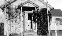 Mountain Road. Virginia Randolph in doorway of her school. A teacher who has mastered her environment. Pupils made repairs: building white washed, flowers planted, etc