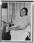 [Hattie McDaniel, three-quarter length portrait, seated at the piano, facing front]