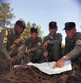 Soldiers reading a map during a military exercise at the U.S. Army training facility at Fort McClellan near Anniston, Alabama.