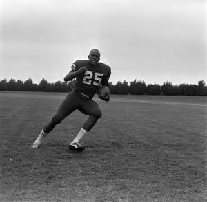 Football player holding a ball, 11