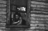 Jasper Wood Collection: Woman looking out window