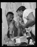 Actress Hattie McDaniel at her dressing table mirror, 1940