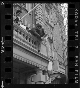 Students involved in sit-in hoist a television up to balcony of Boston University administration building