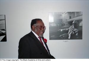 Reverend J. Lee Foster posing with his portrait