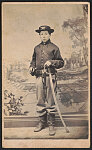 [Unidentified young soldier in Union uniform with sword in front of backdrop showing landscape]