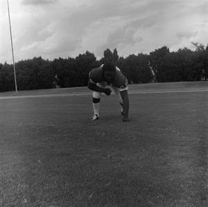 Football player touching the ground, 38