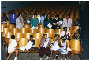 Children and Adults Clapping in Auditorium During Health Fair