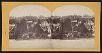 [Soldiers from the 134th Illinois Volunteer Infantry sitting in front of a tent at Columbus, Kentucky with African American boy]