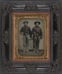 [Two unidentified soldiers in Union cavalry uniforms with Sharps rifles and Colt revolvers]