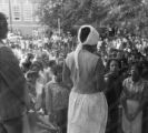 Dorothy Frazier addressing a crowd from the stoop of a brick building at Alabama State College in Montgomery, Alabama, during a student demonstration.