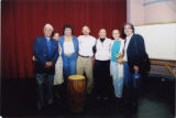 Eugene Redmond and a group posing around a drum