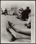 [A pair of muddy shoes underscore the weariness following the 1965 march from Selma to Montgomery, Alabama; state capitol in background]