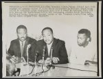 [John Lewis with Ralph Abernathy, and Martin Luther King, Jr. at a press conference during freedom rides]