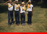 Boys in Camp Gray shirts saluting