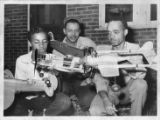 Three Men with Model Airplanes