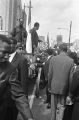 T. Y. Rogers and Jesse Jackson on the cart carrying Martin Luther King, Jr.'s casket during the funeral procession on Auburn Avenue.