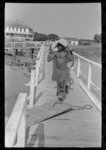 [Untitled photo, possibly related to: Negro stevedore handling lumber in unloading process, Pilottown, Louisiana, the "El Rito"]