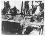 Bagobo women making bead ornaments