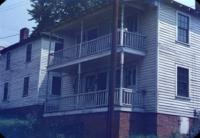 Two Story Wood Frame House with Porches