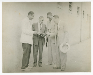 Photograph of four employees outside Atlanta Life