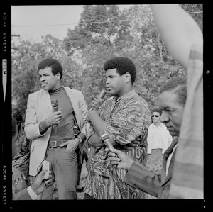 Two men addressing the crowd at Franklin Park rally