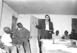 Man addressing an audience at the office of the Autauga County Improvement Association in Prattville, Alabama.