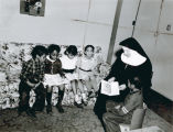 A Blessed Sacrament Sister teaching in a Private Home, Gary, Indiana, Undated