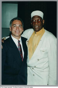 Photograph of a man and Albert Lipscomb posing for a camera