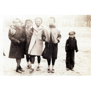 Young African American children pose in the park