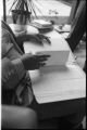 Margaret Walker Alexander with letters, Donald Gallup, in office at Beincke Library at Yale University, 1978.(YSP 25-78-4)