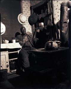 Kitchen with one-armed man, Pittsburgh : photonegatives.