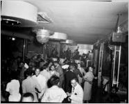 African-Americans on dance-floor, band in the background, at the 180 Club, Atlanta, Georgia; party sponsored by Davison-Paxon, December 3, 1953