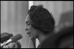 Coretta Scott King addressing the Solidarity Day crowd at the Poor People's March on Washington, speaking against the War in Vietnam Portrait in profile, at the microphones