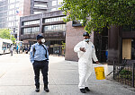 Daniel wearing PPE to disinfect buses, Woodhull Hospital, Marcus Garvey Blvd. by Broadway, Brooklyn