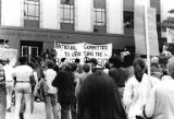 Bakke Decision Protest depicting people holding protest signs and gathering on the steps of the United States Courthouse in Seattle, Washington, 1977