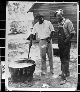 Photograph of Raymond Williams and Manuel Glanton making stew, Carroll County, Georgia, 1948 Aug. 31