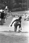 Carl Lewis completing a broad jump, Los Angeles, 1982